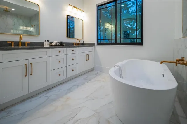 a bedroom with a large bed and a large window