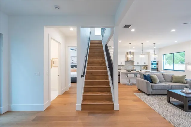 a bathroom with a granite countertop sink mirror and toilet