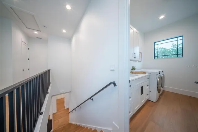 a living room with wooden floor and furniture