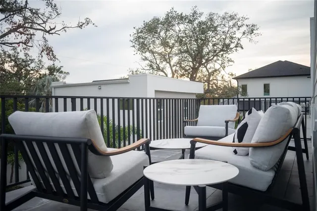 a bedroom with a large bed and a large window