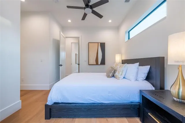 a view of a house with pool and sitting area