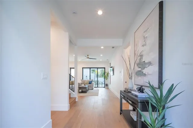a kitchen with stainless steel appliances granite countertop a sink refrigerator and cabinets