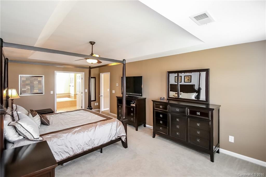 382 Fischer Road Fort Mill, SC 29715 - Photo 13 of 24 a bedroom with a bed and wooden floor