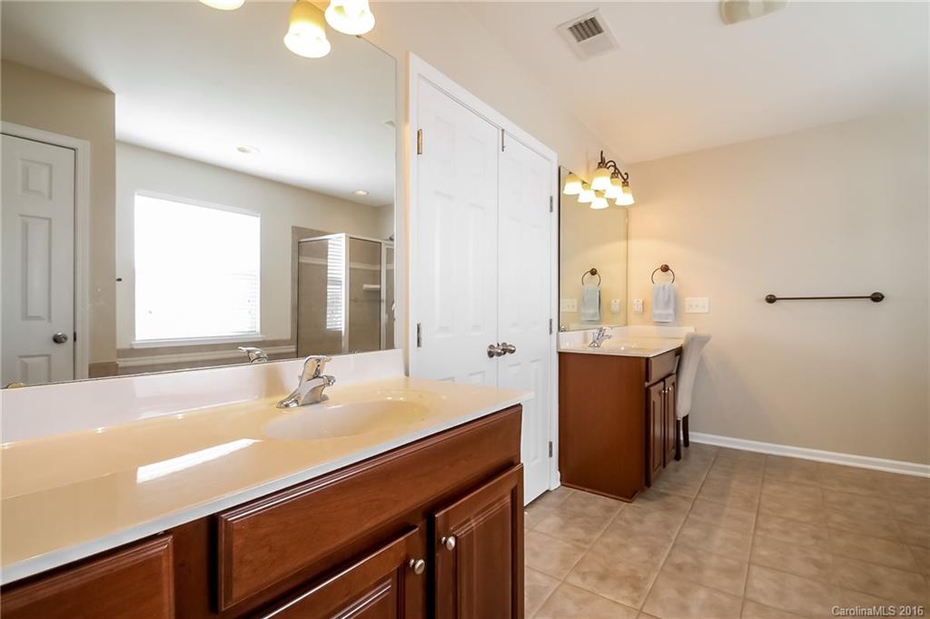 382 Fischer Road Fort Mill, SC 29715 - Photo 14 of 24 a spacious bathroom with a sink double vanity and a mirror