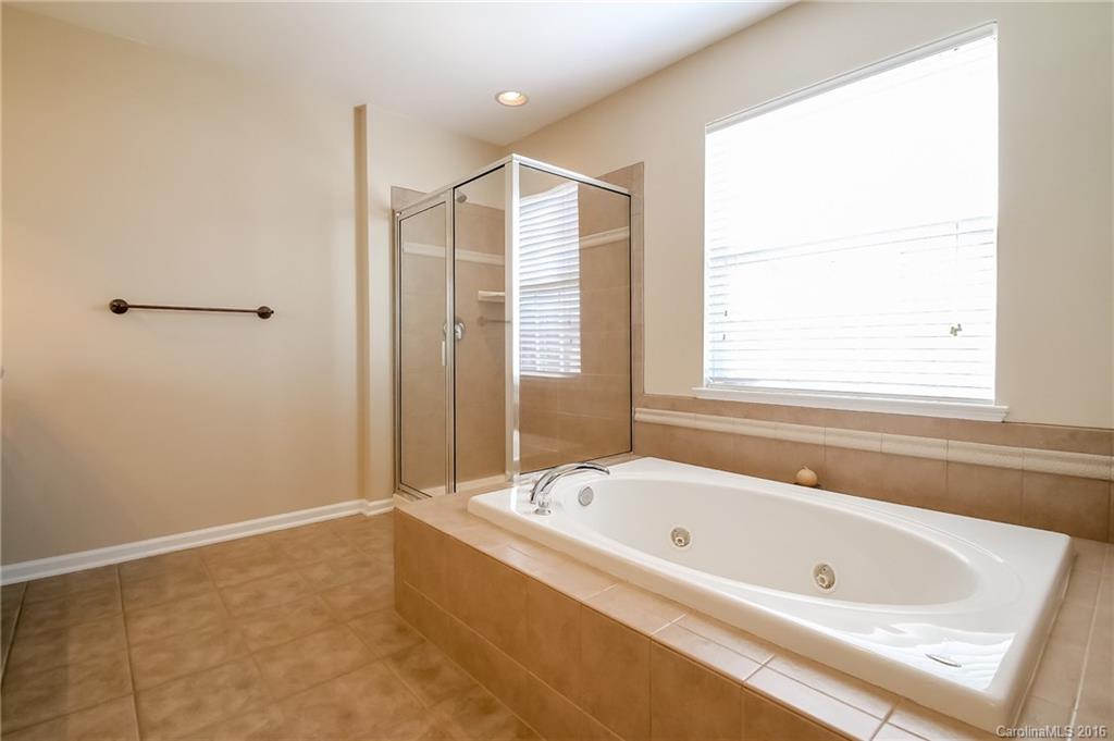 382 Fischer Road Fort Mill, SC 29715 - Photo 15 of 24 a bathroom with a bathtub and a shower