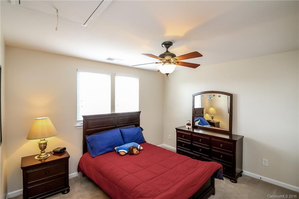 382 Fischer Road Fort Mill, SC 29715 - Photo 18 of 24 a bedroom with a bed and a window
