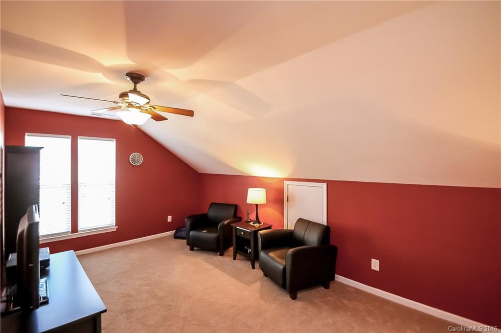 382 Fischer Road Fort Mill, SC 29715 - Photo 19 of 24 a living room with furniture and a chandelier