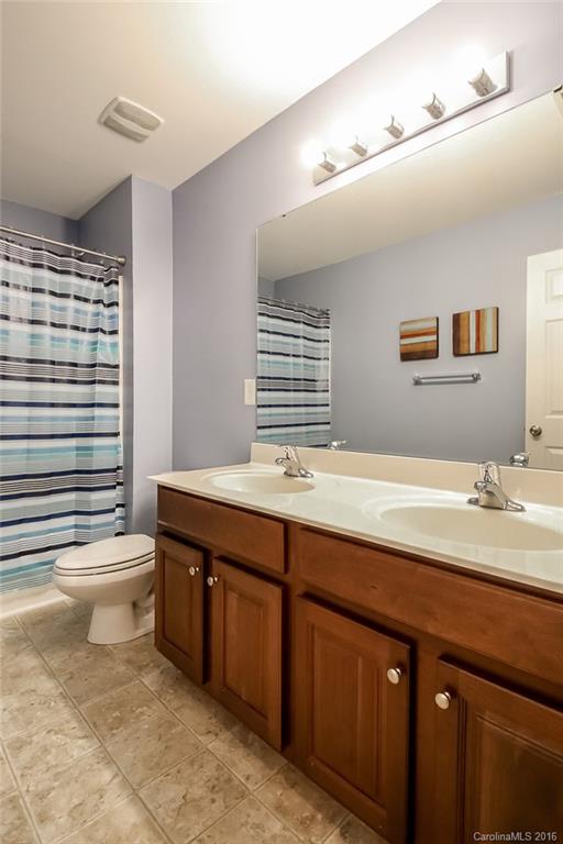 382 Fischer Road Fort Mill, SC 29715 - Photo 20 of 24 a bathroom with a double vanity sink toilet and a bathtub