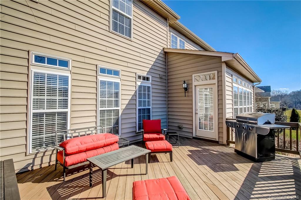 382 Fischer Road Fort Mill, SC 29715 - Photo 22 of 24 a balcony with furniture and wooden floor
