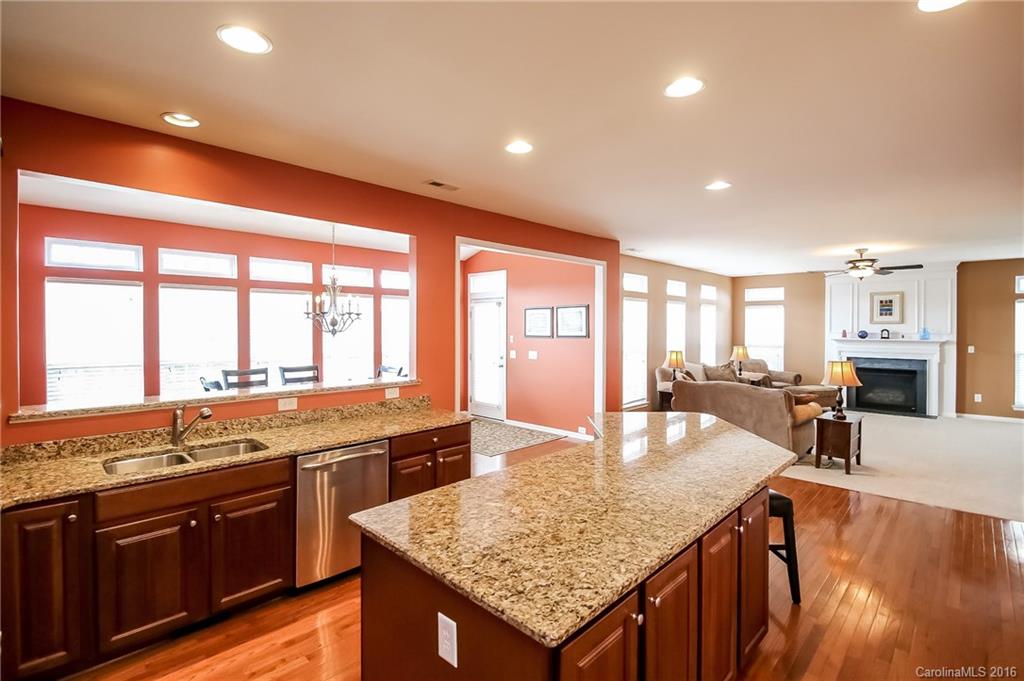 382 Fischer Road Fort Mill, SC 29715 - Photo 6 of 24 a large kitchen with granite countertop lots of counter top space and stainless steel appliances