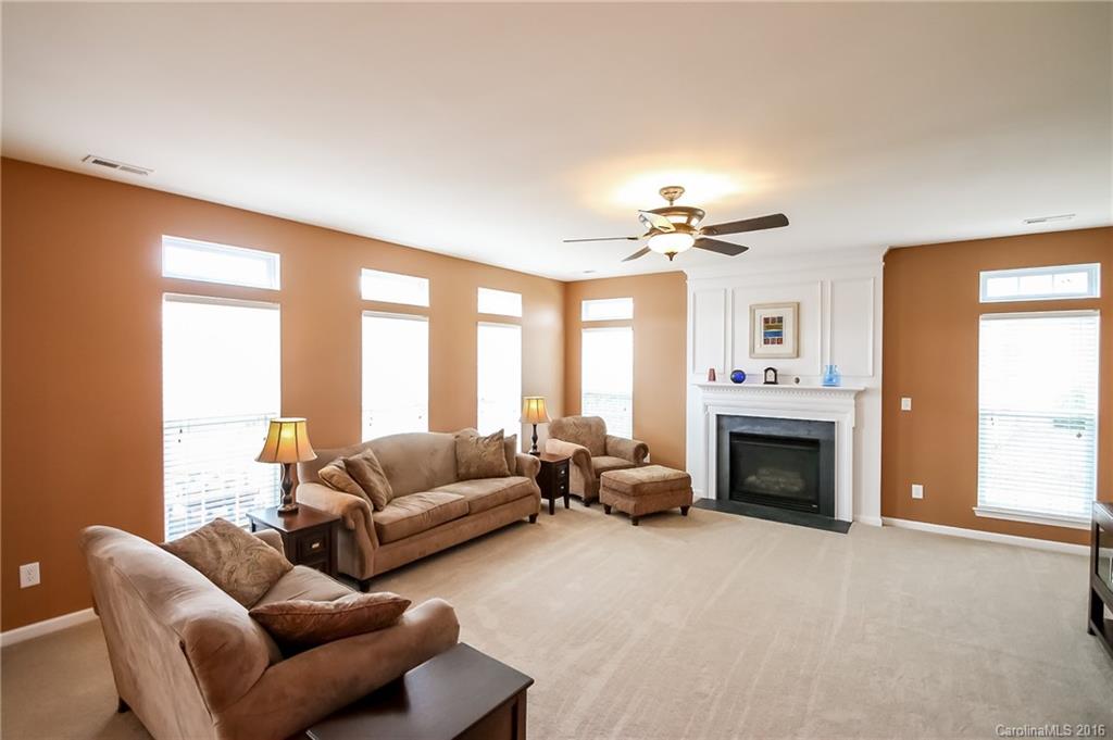 382 Fischer Road Fort Mill, SC 29715 - Photo 8 of 24 a living room with furniture fireplace and a large window