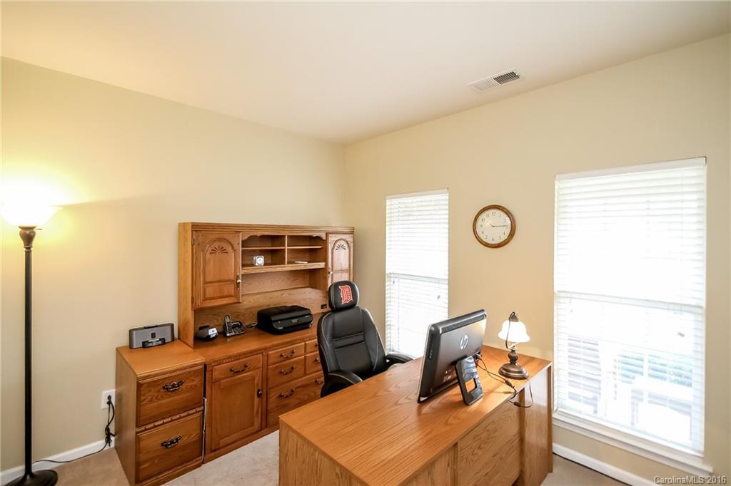 382 Fischer Road Fort Mill, SC 29715 - Photo 10 of 24 a living room with furniture stove and a window