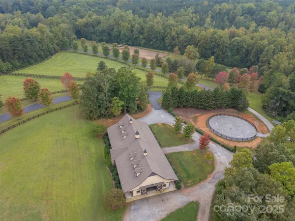 an aerial view of a house with a swimming pool