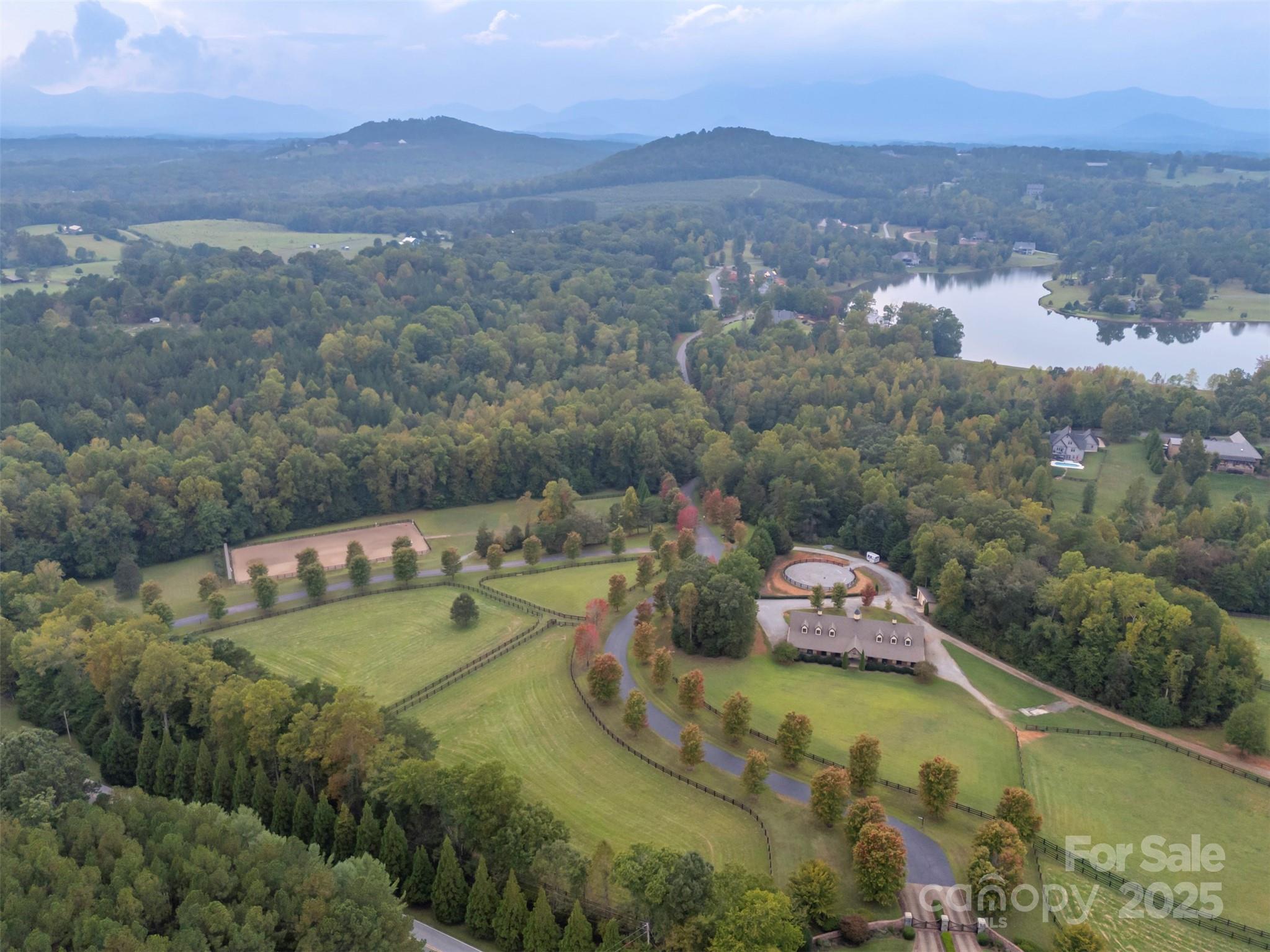 Lot 20 Mapleton Lane Tryon, NC 28782 - Photo 29 of 32 a view of a lake with a mountain in the background
