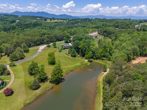 a view of a lake with a yard