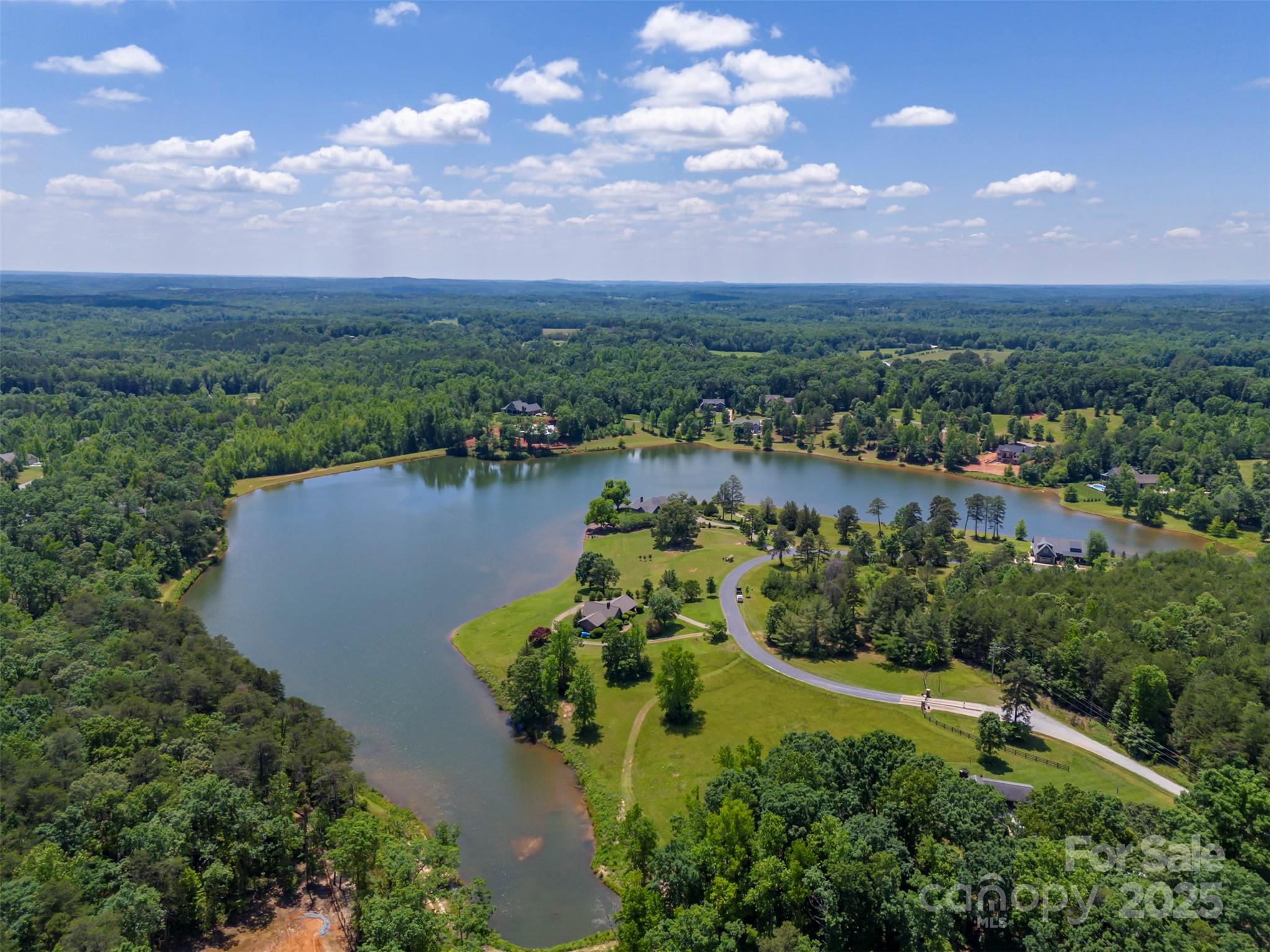 Lot 20 Mapleton Lane Tryon, NC 28782 - Photo 4 of 32 an aerial view of a houses with outdoor space and ocean view