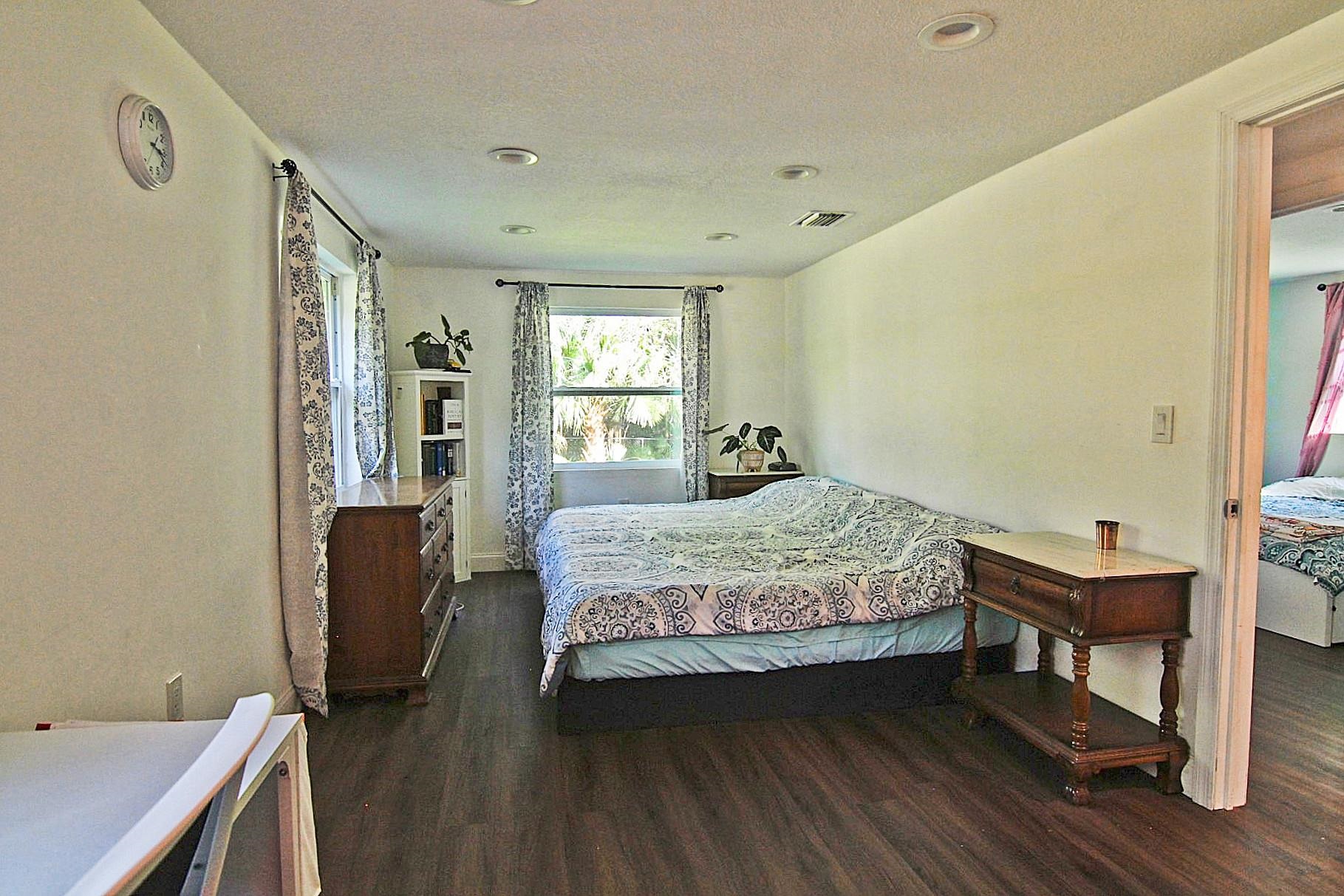 561 Tart Road St. Augustine, FL 32084 - Photo 8 of 15 a bedroom with a bed and a window