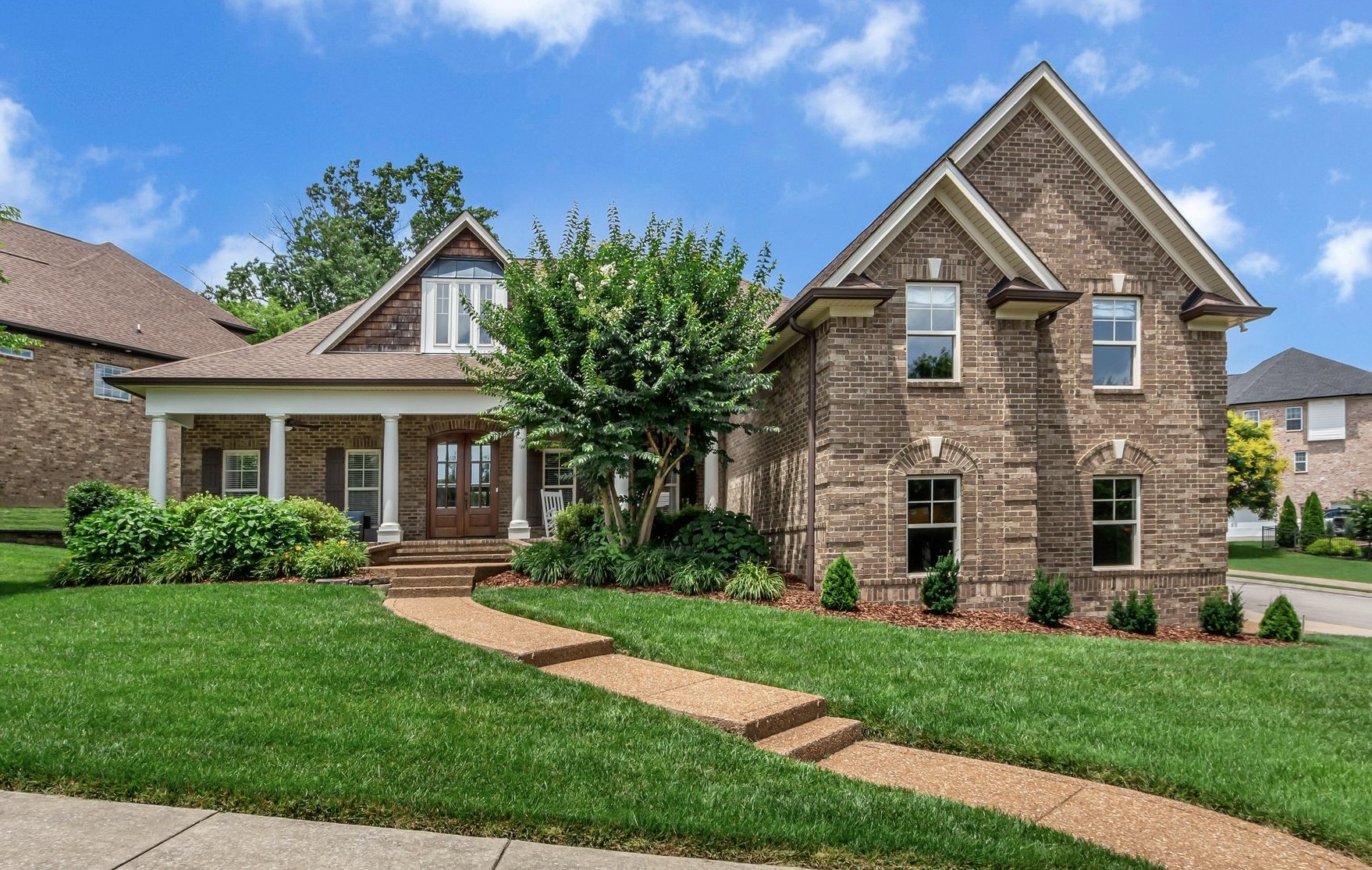 a front view of a house with a yard