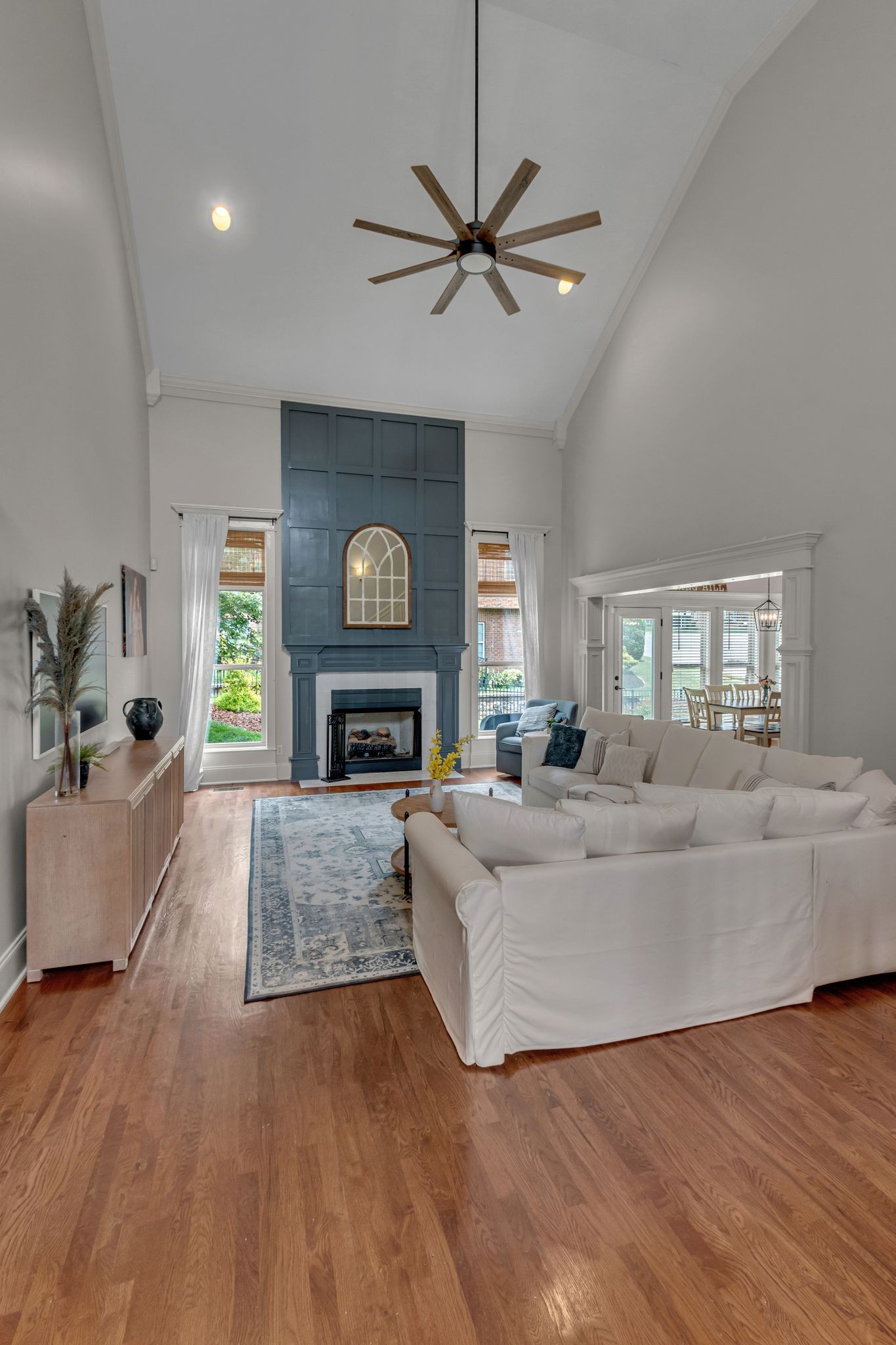 1051 Fitzroy Circle Spring Hill, TN 37174 - Photo 15 of 38 a living room with furniture a fireplace and a flat screen tv
