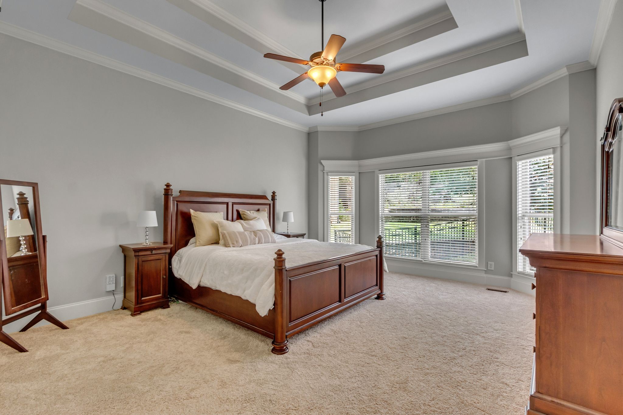 1051 Fitzroy Circle Spring Hill, TN 37174 - Photo 21 of 38 a bedroom with a bed and a ceiling fan