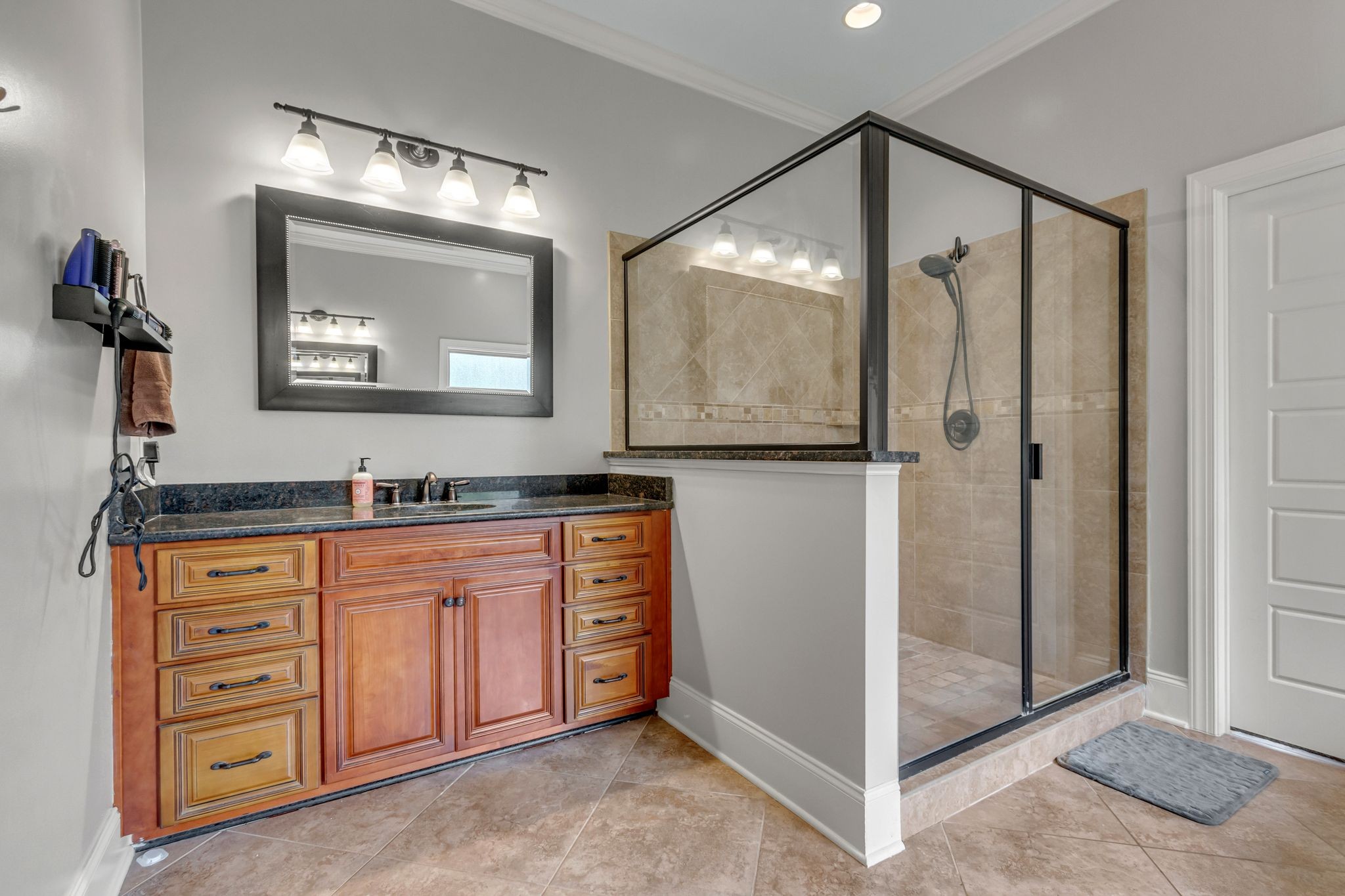 1051 Fitzroy Circle Spring Hill, TN 37174 - Photo 24 of 38 a bathroom with a granite countertop sink mirror and vanity