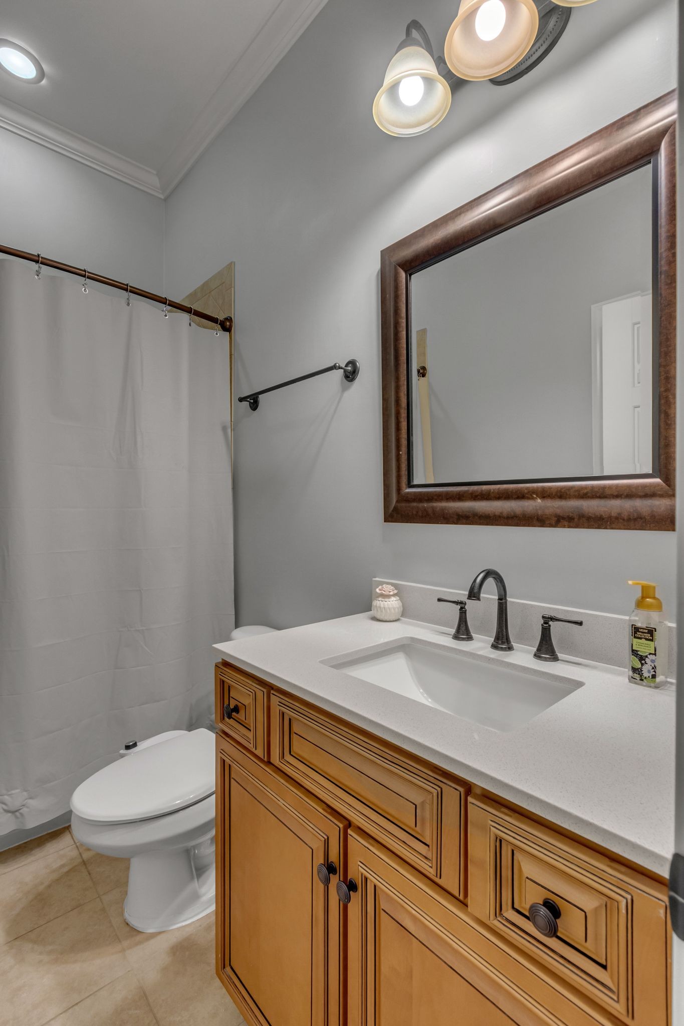 1051 Fitzroy Circle Spring Hill, TN 37174 - Photo 29 of 38 a bathroom with a granite countertop sink mirror vanity and toilet