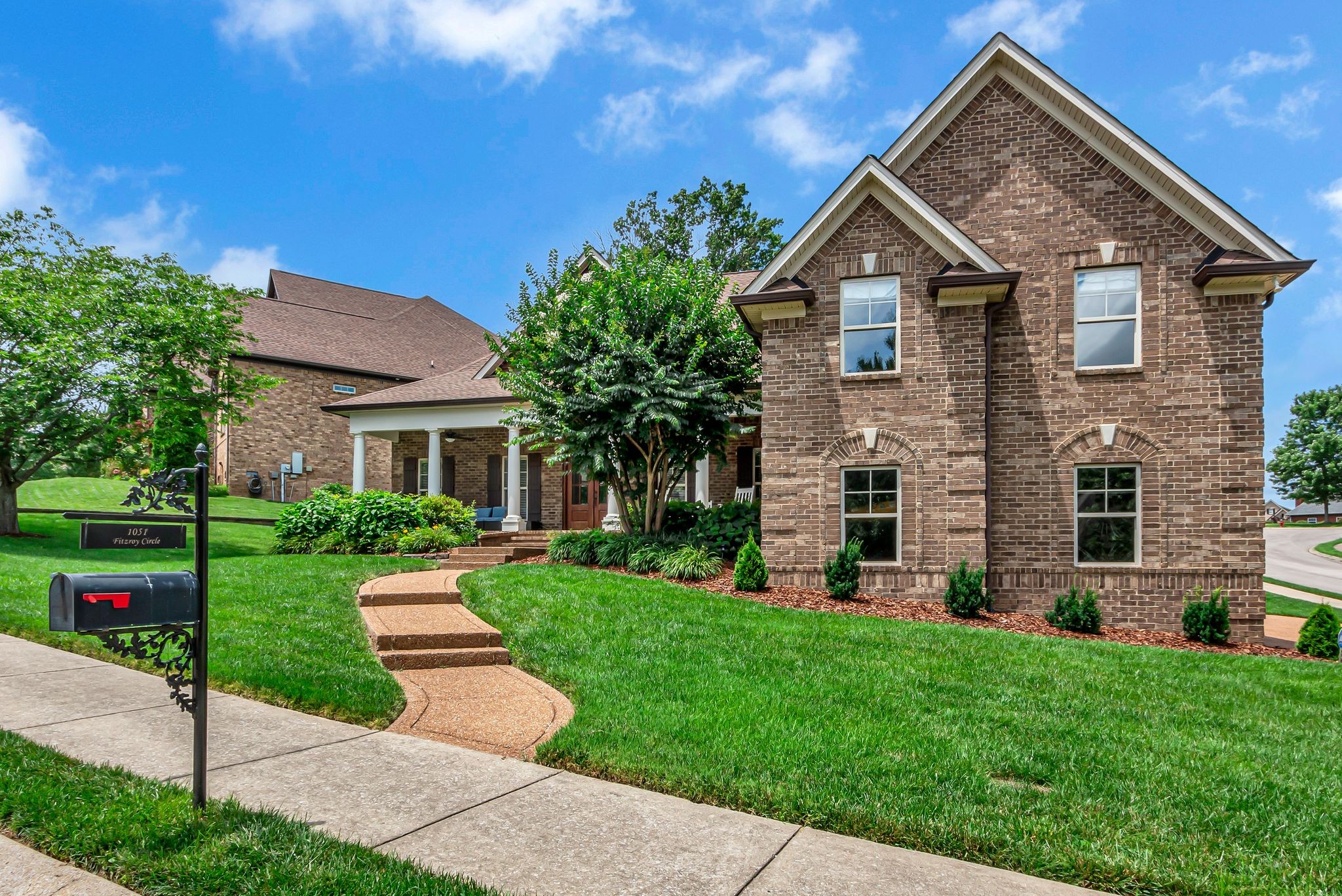 1051 Fitzroy Circle Spring Hill, TN 37174 - Photo 3 of 38 a front view of a house with a yard