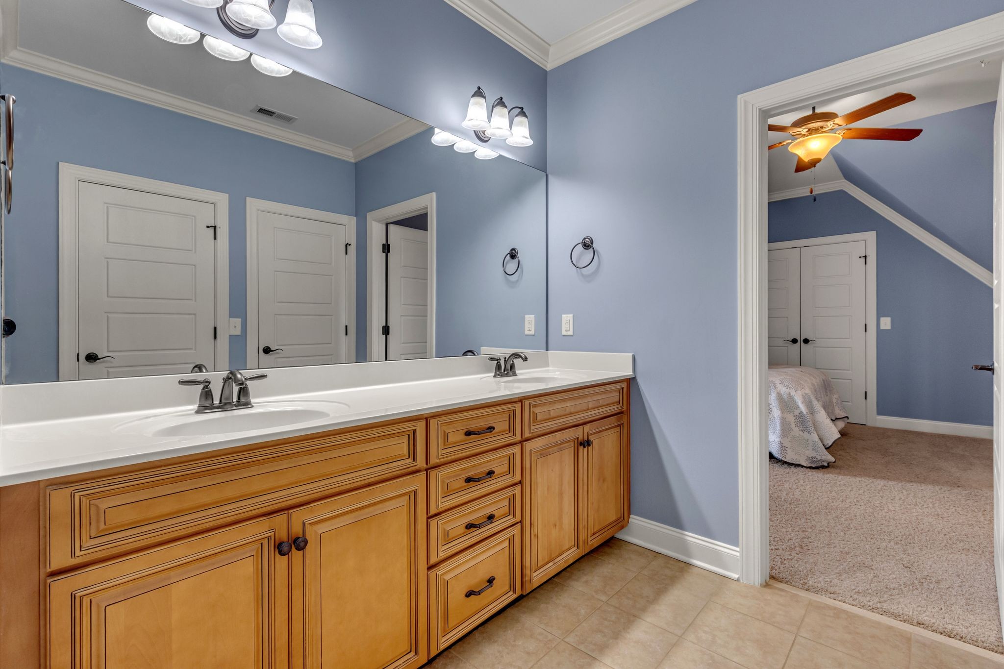 1051 Fitzroy Circle Spring Hill, TN 37174 - Photo 32 of 38 a spacious bathroom with a double vanity sink and a mirror