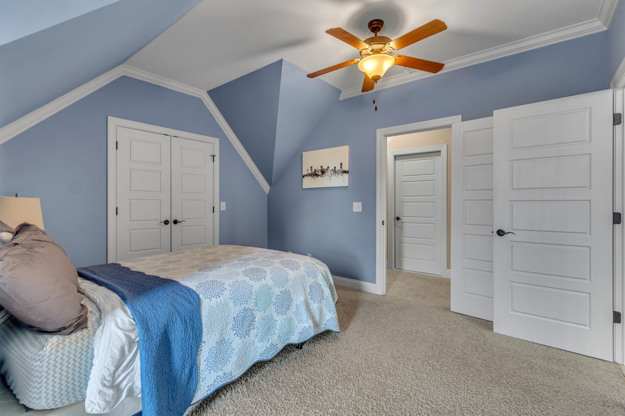 1051 Fitzroy Circle Spring Hill, TN 37174 - Photo 34 of 38 a bedroom with a bed and a ceiling fan
