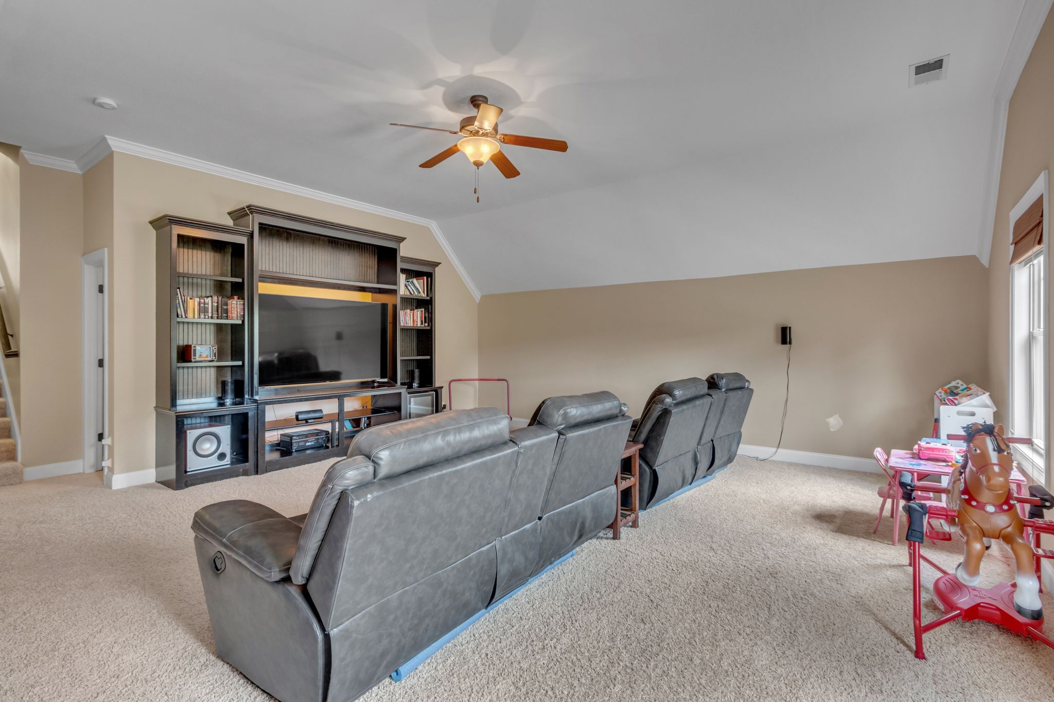 1051 Fitzroy Circle Spring Hill, TN 37174 - Photo 36 of 38 a living room with furniture and a flat screen tv