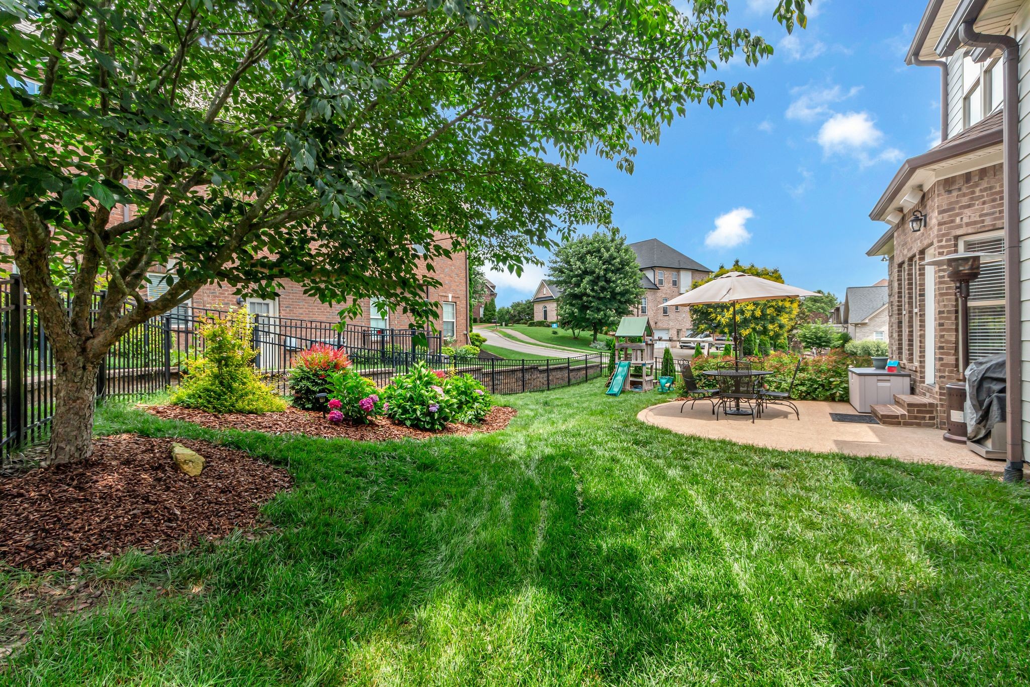 1051 Fitzroy Circle Spring Hill, TN 37174 - Photo 37 of 38 a view of a house with backyard and sitting area