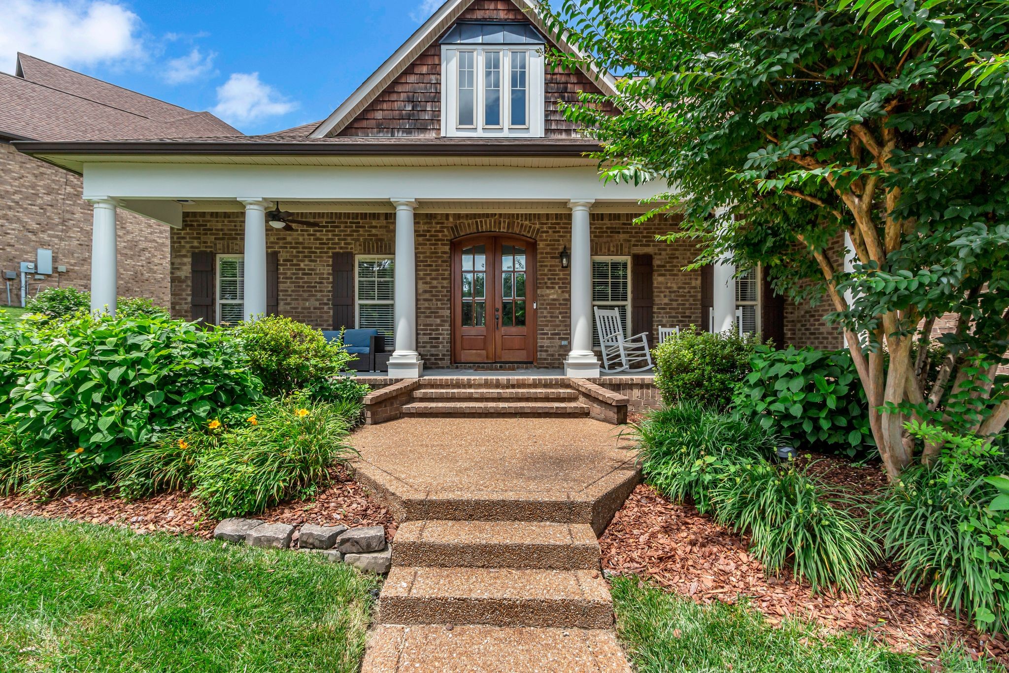 1051 Fitzroy Circle Spring Hill, TN 37174 - Photo 5 of 38 front view of a brick house with a small yard
