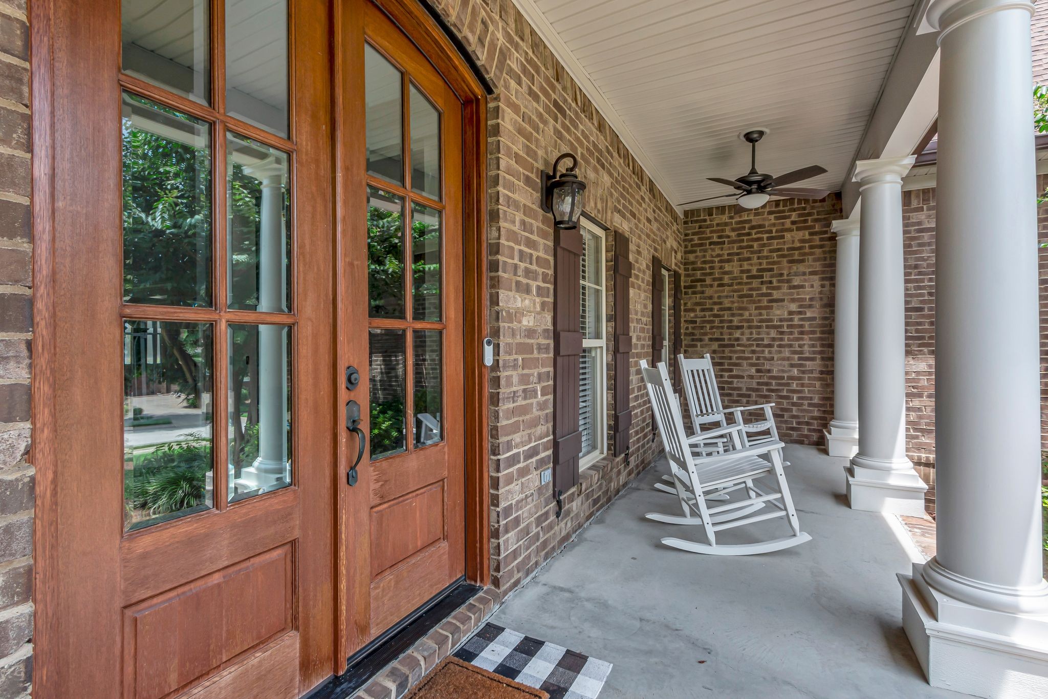 1051 Fitzroy Circle Spring Hill, TN 37174 - Photo 6 of 38 a porch with a bench next to a large window