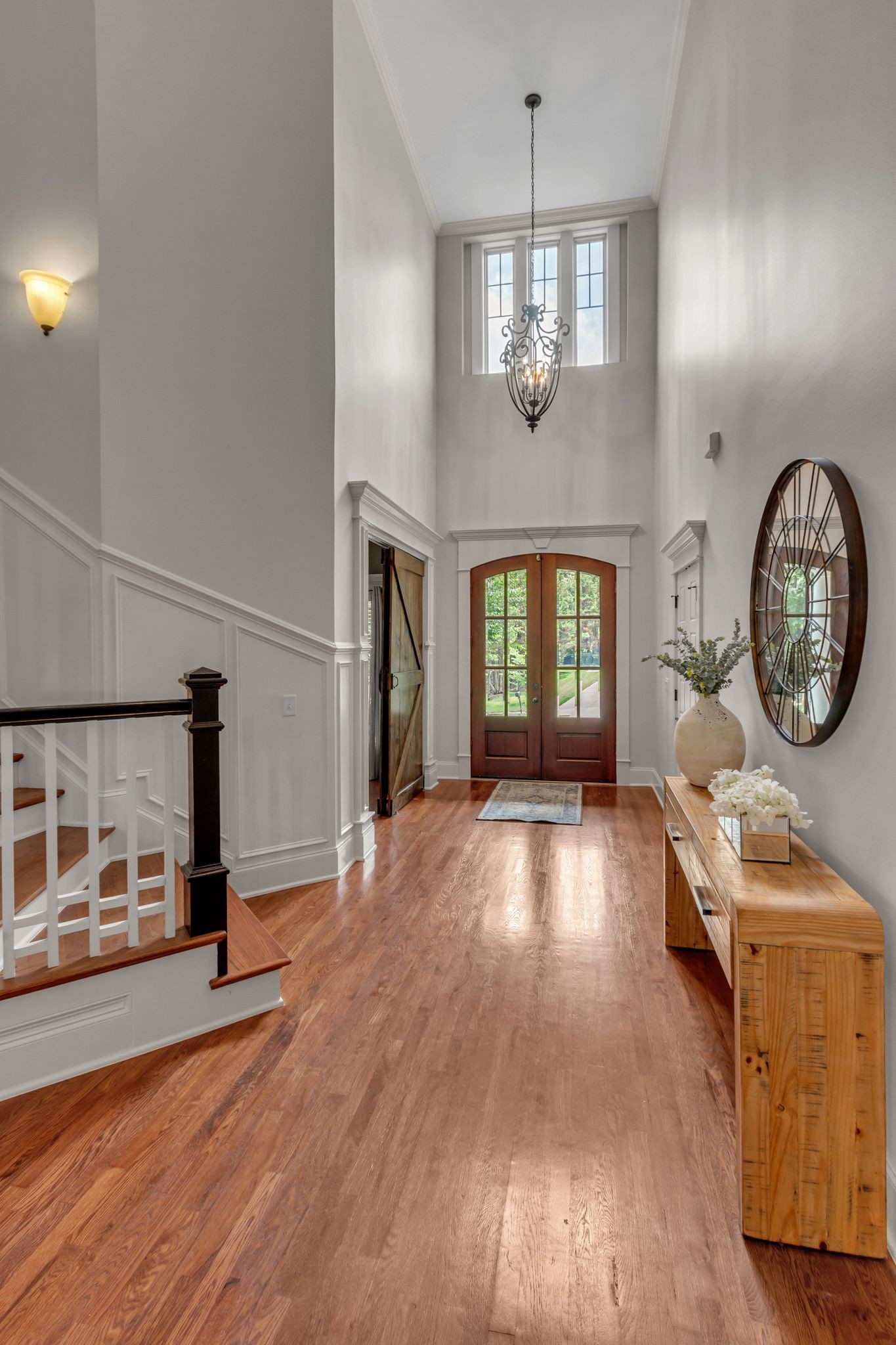 1051 Fitzroy Circle Spring Hill, TN 37174 - Photo 7 of 38 an empty room with wooden floor chandelier and windows