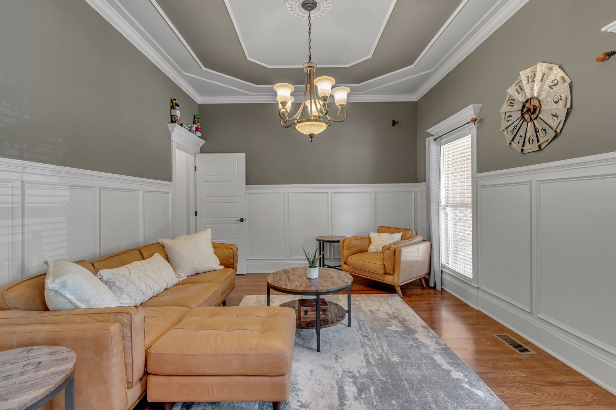 1051 Fitzroy Circle Spring Hill, TN 37174 - Photo 9 of 38 a living room with furniture and a chandelier