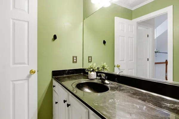 a bathroom with a sink and a mirror