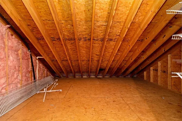a view of an empty room with stairs