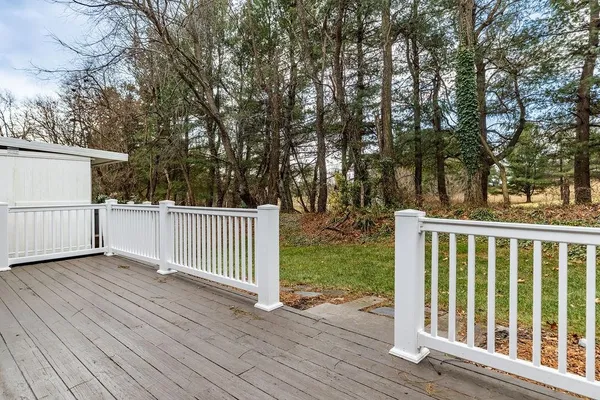 a view of deck with wooden floor and fence