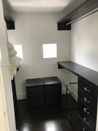 a view of workspace with furniture and window