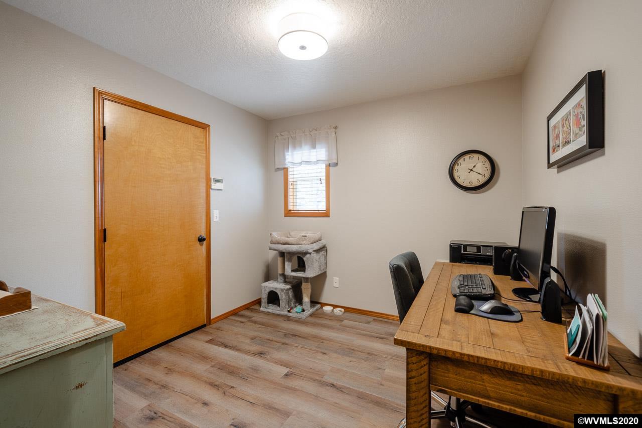 15241 Strong Road Dallas, OR 97338 - Photo 22 of 40 a view of a workspace with furniture and a window