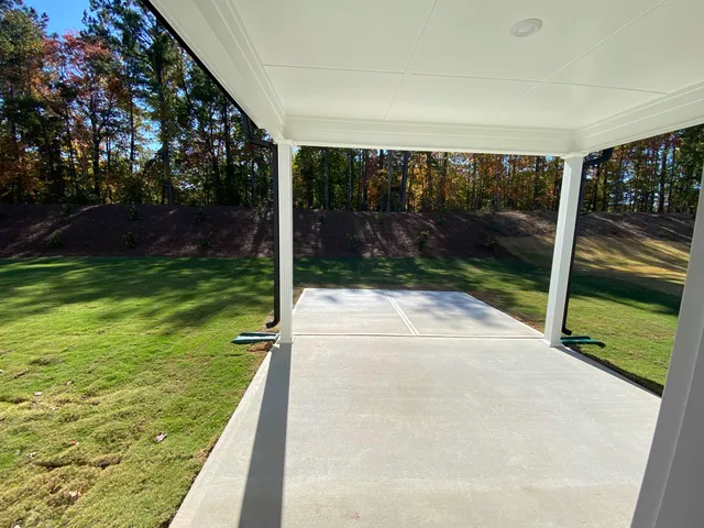 a view of backyard with green space