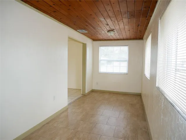 a view of an empty room and window