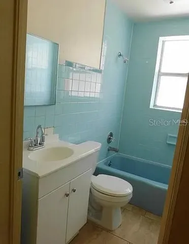 a bathroom with a glass door shower