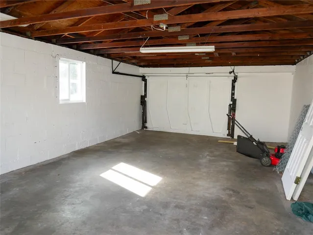 a view of a room with window and furniture