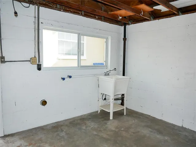 a view of a garden with a house in the background