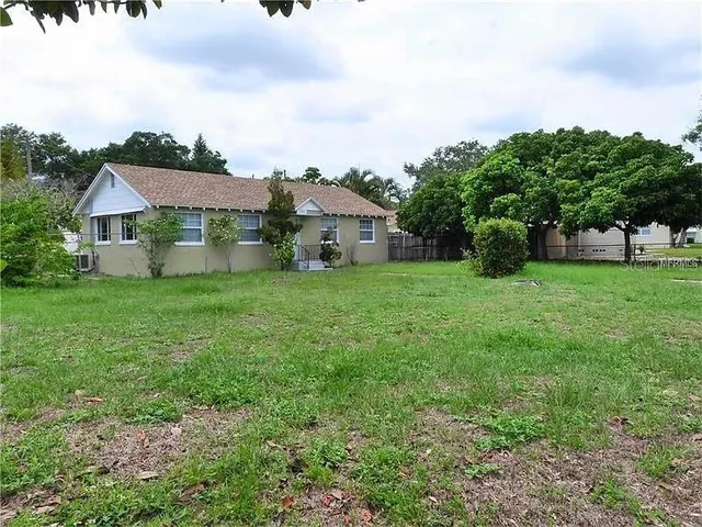 a house view with a backyard space