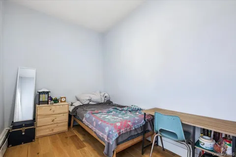 a bedroom with a bed and a bookshelf
