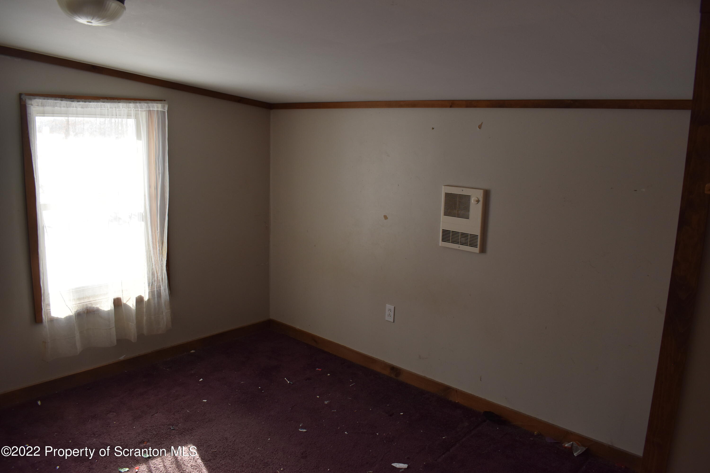 422 Ervine Road Montrose, PA 18801 - Photo 10 of 14 a view of an empty room and a window