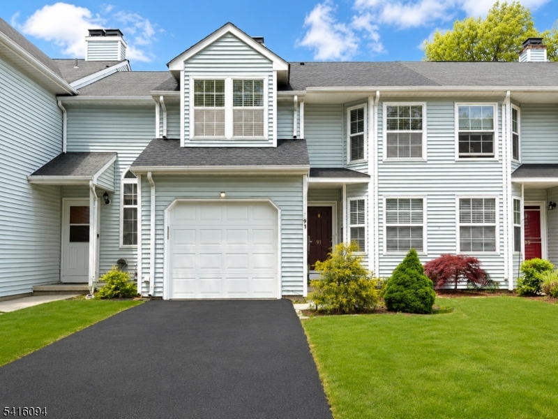 91 Delaware Lane, Unit 91 Somerville, NJ 08876 - Photo 1 of 32 a front view of a house with garden