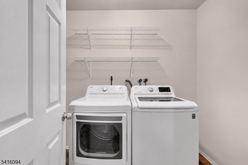 91 Delaware Lane, Unit 91 Somerville, NJ 08876 - Photo 14 of 32 a utility room with dryer and washer